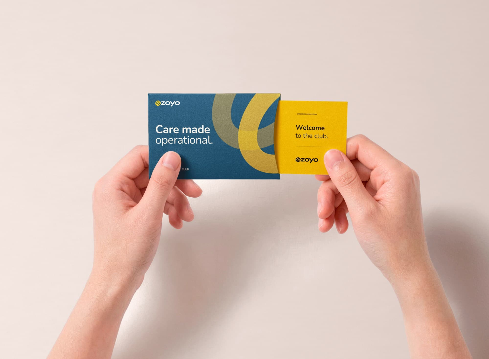 Zoyo business card and sliding sleeve held in two hands