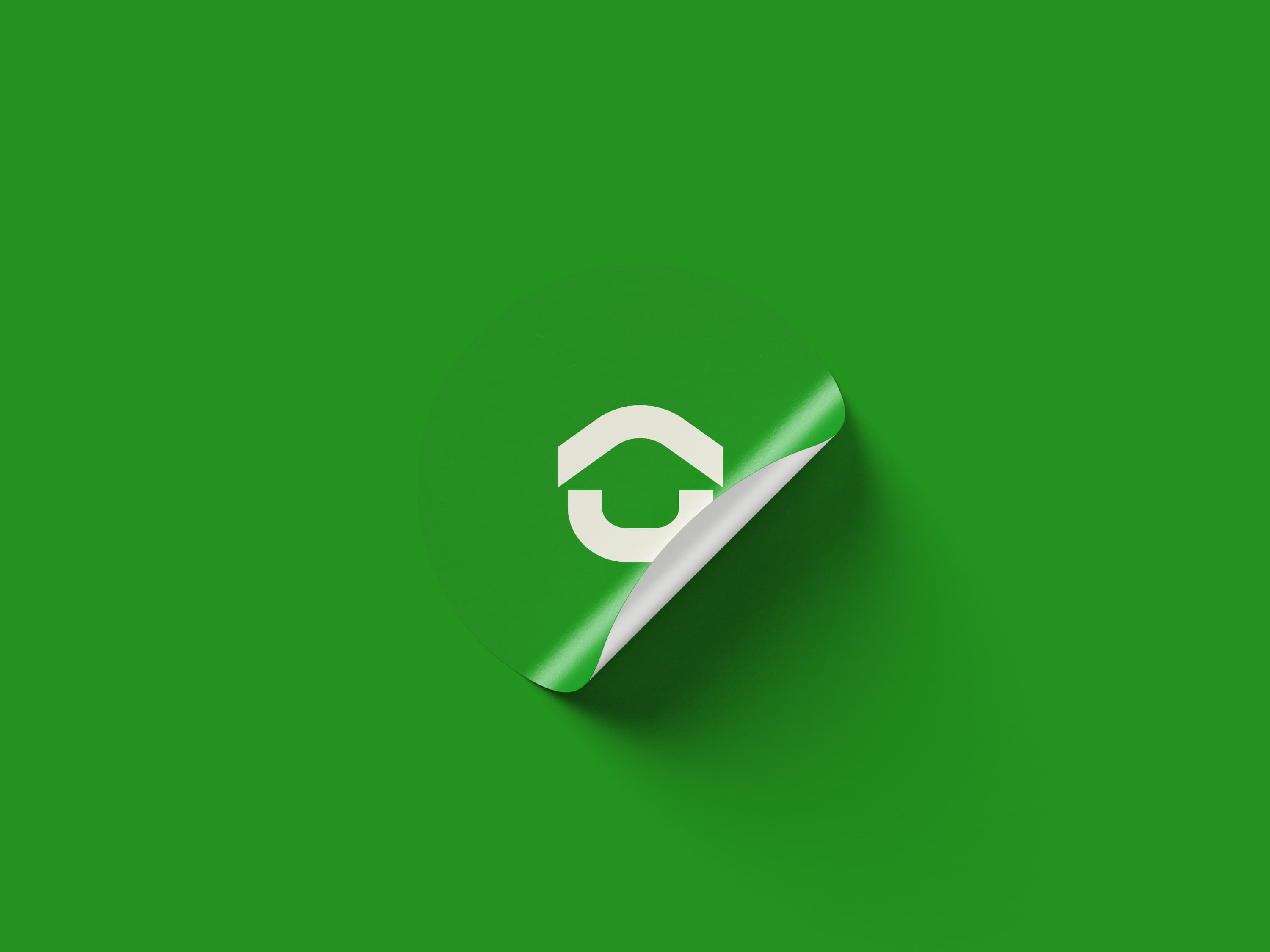 Managemate symbol on a peeling white sticker against green